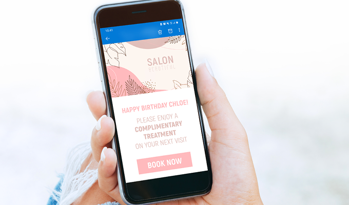A hair salon client receiving an automatic email that says Happy Birthday Chloe Please enjoy a complimentary treatment on your next visit Book Now 